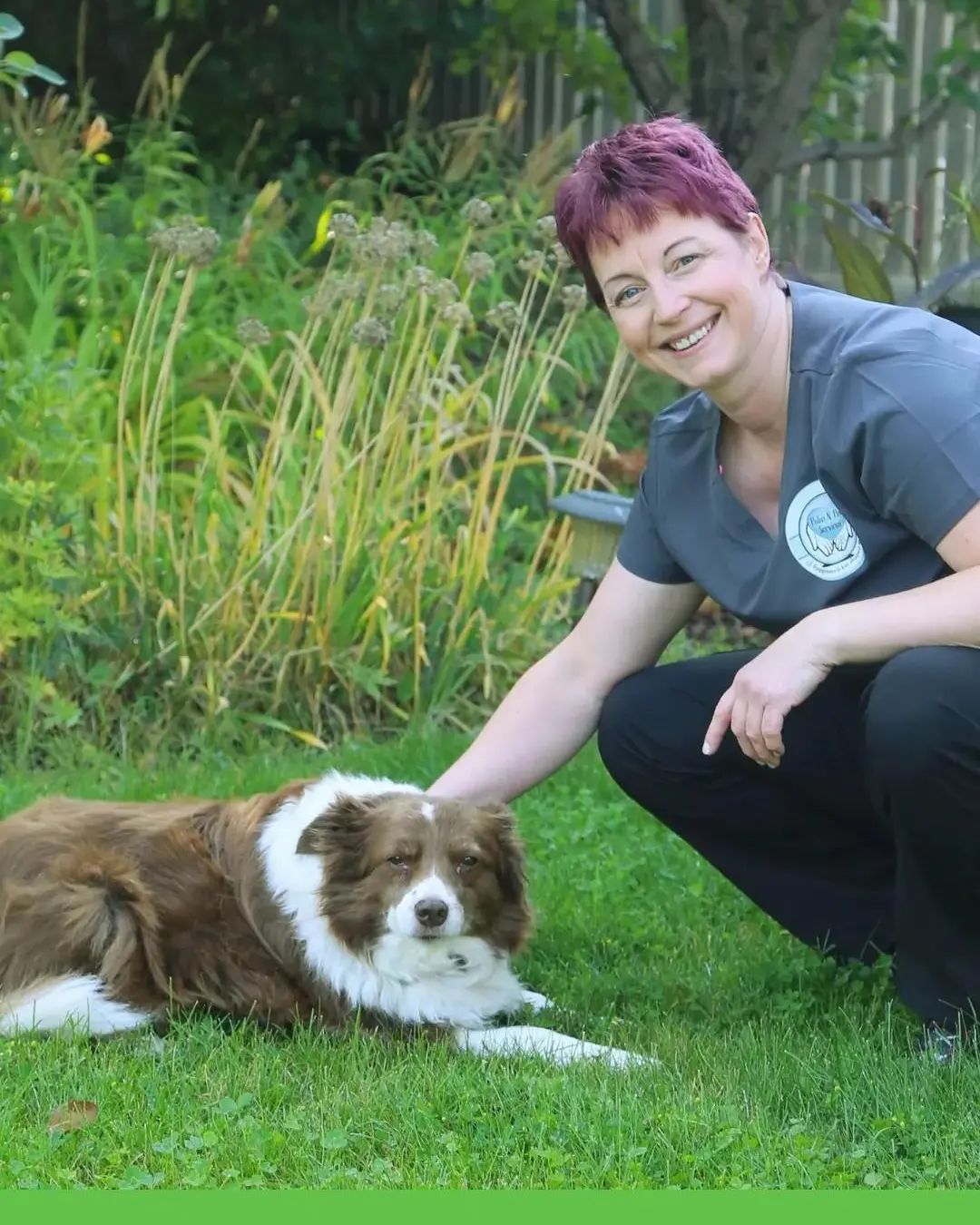 Dee, founder of Palm N Paw Services, with a friendly border collie in the garden